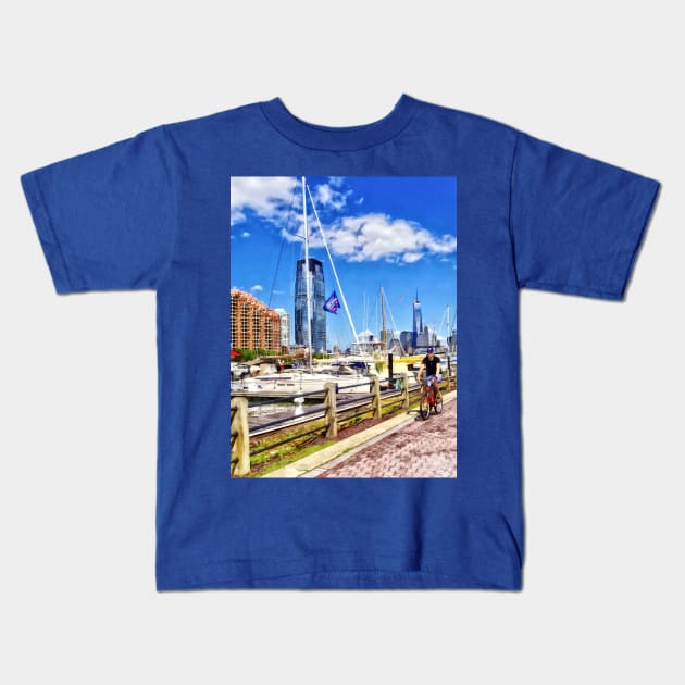 Jersey City NJ - Bicycling Along Liberty Landing Marina Kids T-Shirt by SusanSavad